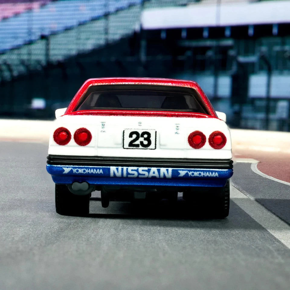 Nissan car with '23' on a racetrack