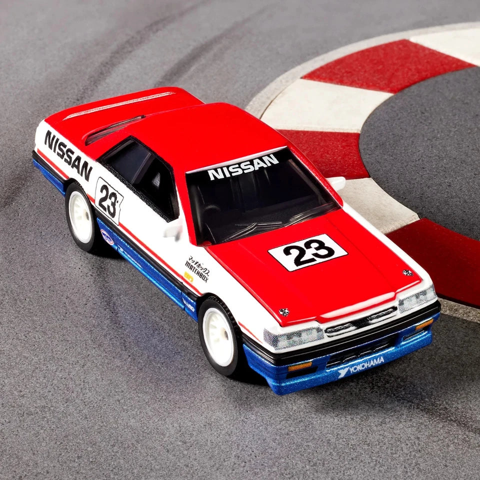 Model car with Nissan branding on a racetrack