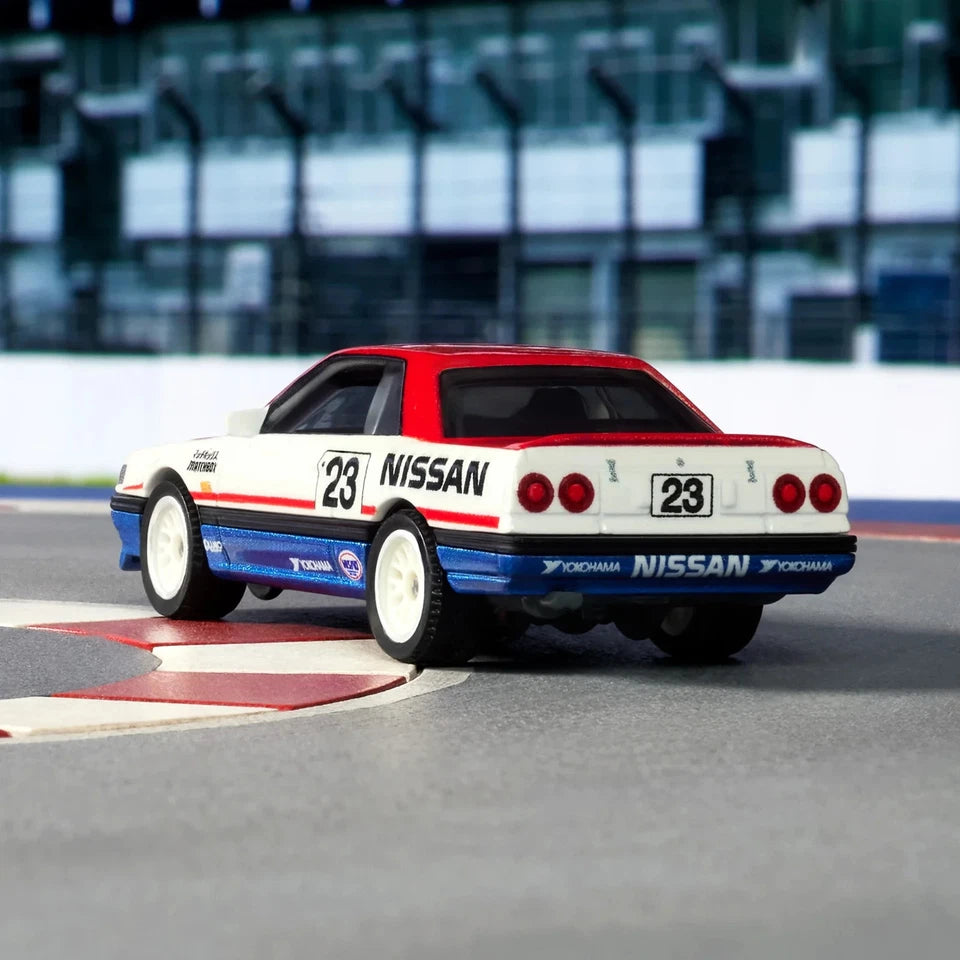 Nissan race car on a track with blurred background