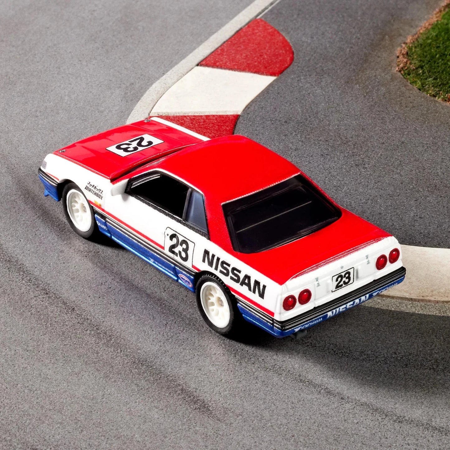 Model car with 'Nissan' branding on a racetrack
